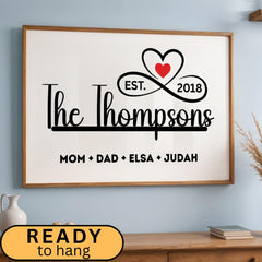 Personalized family name sign with custom family members print in a sleek black and white minimalist design. Framed canvas wall décor ideal for farmhouse, modern, or contemporary home settings. Thoughtful housewarming, wedding, or anniversary gift idea for families and couples. Perfect for display in living rooms, entryways, offices, or hallways as a meaningful keepsake. With infinity sign and a heart icon design, perfect for Christmas Season, Valentines and mother's day
