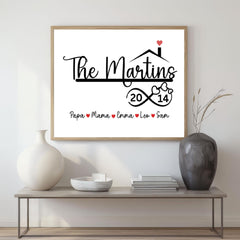 Canvas wall décor featuring a personalized farmhouse family name design and anniversary year in a matte black and white print. Custom framed wall art keepsake perfect for modern, rustic, or minimalist interiors. Ideal gift for housewarmings, weddings, anniversaries, or new homeowners. Display in living rooms, entryways, bedrooms, or offices for a meaningful decorative touch. With heart icons and infinity sign
