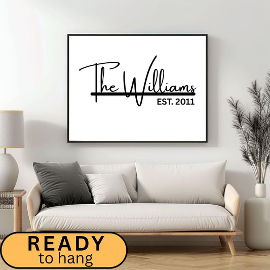 Custom framed canvas sign featuring a personalized family name and the anniversary date in a black and white minimalist style. Elegant wall art decor perfect for farmhouse, modern, or neutral-themed interiors. Ideal for home or office wall display in living rooms, entryways, or workspaces. Thoughtful housewarming, wedding, or anniversary gift idea with a timeless design.
