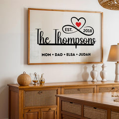 Personalized family name sign with custom family members print in a sleek black and white minimalist design. Framed canvas wall décor ideal for farmhouse, modern, or contemporary home settings. Thoughtful housewarming, wedding, or anniversary gift idea for families and couples. Perfect for display in living rooms, entryways, offices, or hallways as a meaningful keepsake. With infinity sign and a heart icon design, perfect for Christmas Season, Valentines and mother's day
